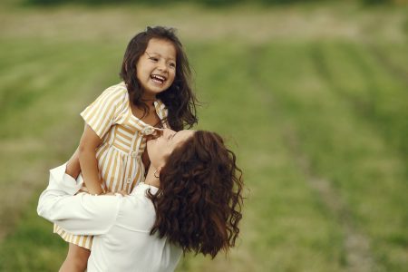 Family in a summer field. Sensual photo. Cute little girl.